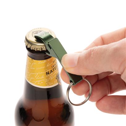 Green Recycled Aluminum Bottle & Can Opener in use on a bottle